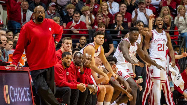 Indiana Head Coach Mike Woodson and the coaching staff wear red sweaters during the first half of the Indiana versus Army men's basketball game at Simon Skjodt Assembly Hall.